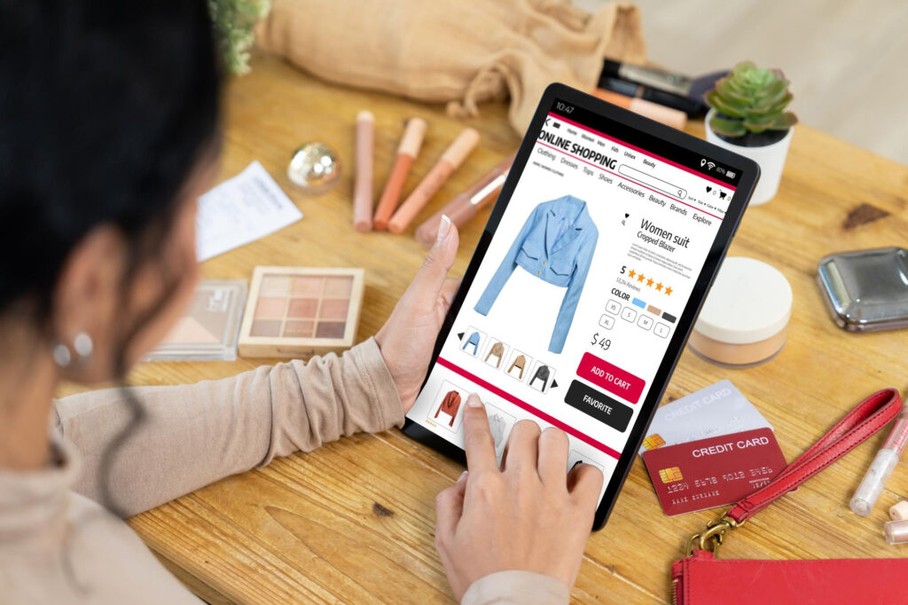 Photo of a woman browsing an ecommerce shop on her tablet