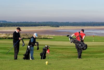 Photo of golfers on a golf course.