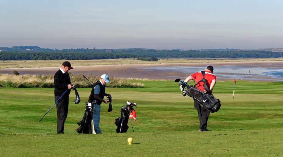 Photo of golfers on a golf course.